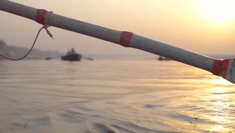 slow motion oar stroke at sundown