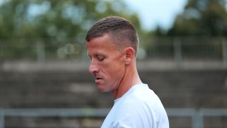 360 degree head shot of an athletic middle-aged man before the start of training session