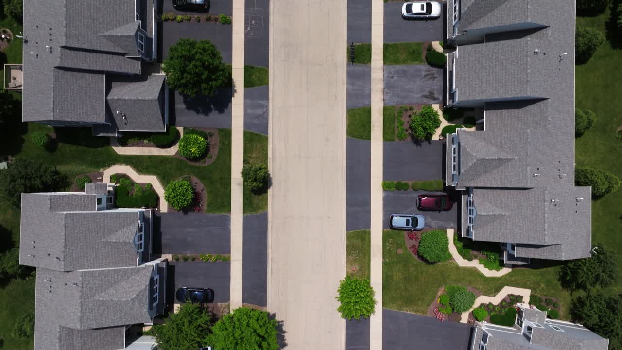 Aerial View of a Residential Area with Townhouses and Cars