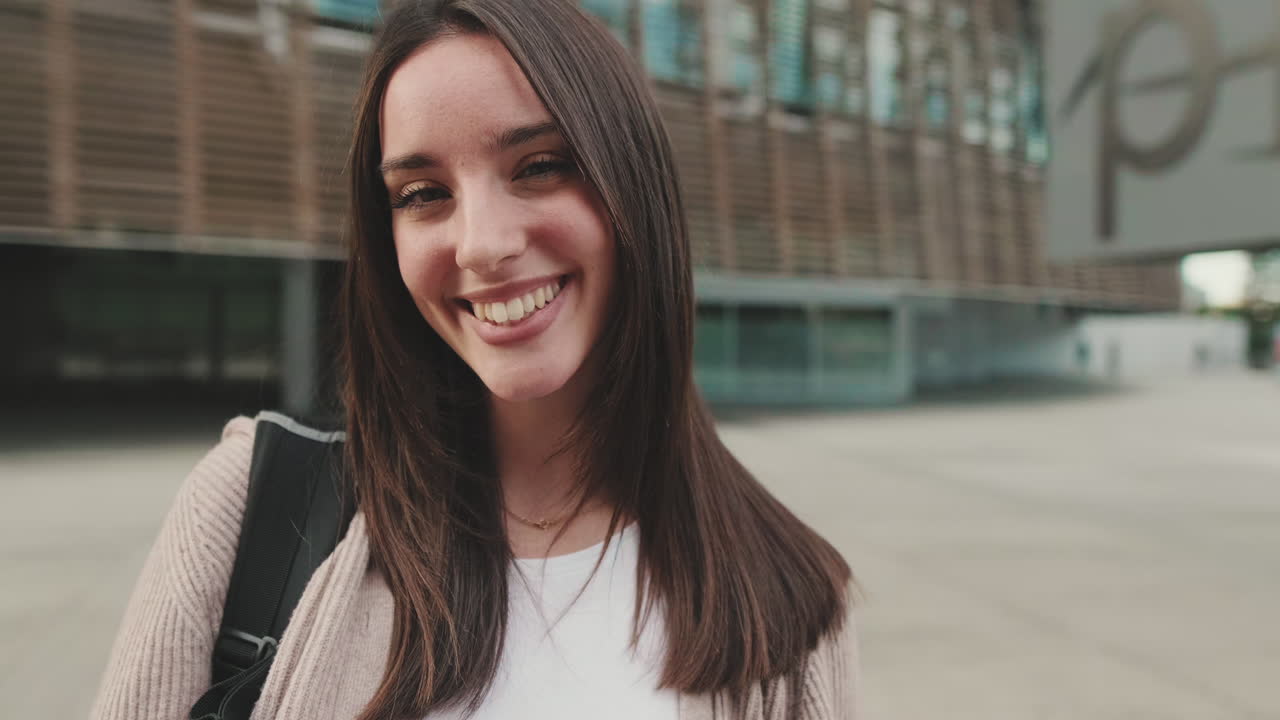 Portrait of a Smiling Brunette Woman Outdoors