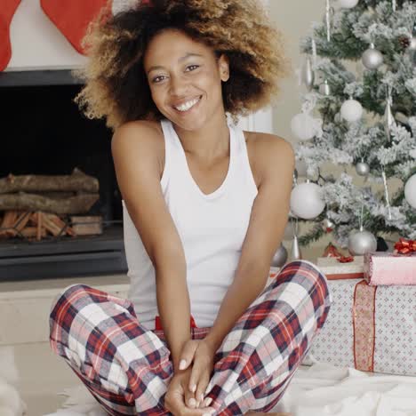 Cute-young-woman-and-her-dog-at-Christmas