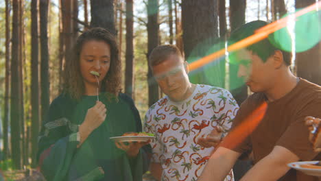 friends enjoying a picnic in the forest