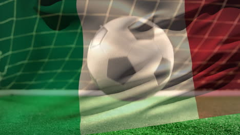 football bouncing on the floor in front of the goal with an italian flag on the foreground