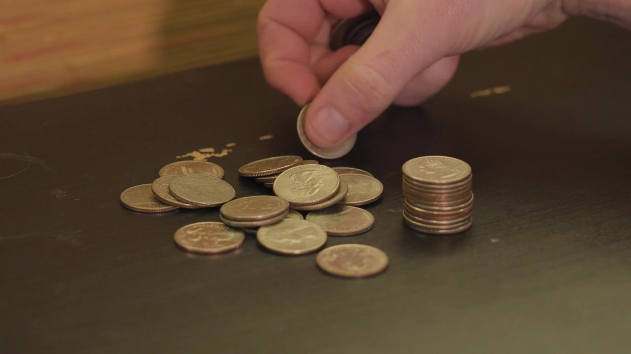Counting up quarters for hard times.