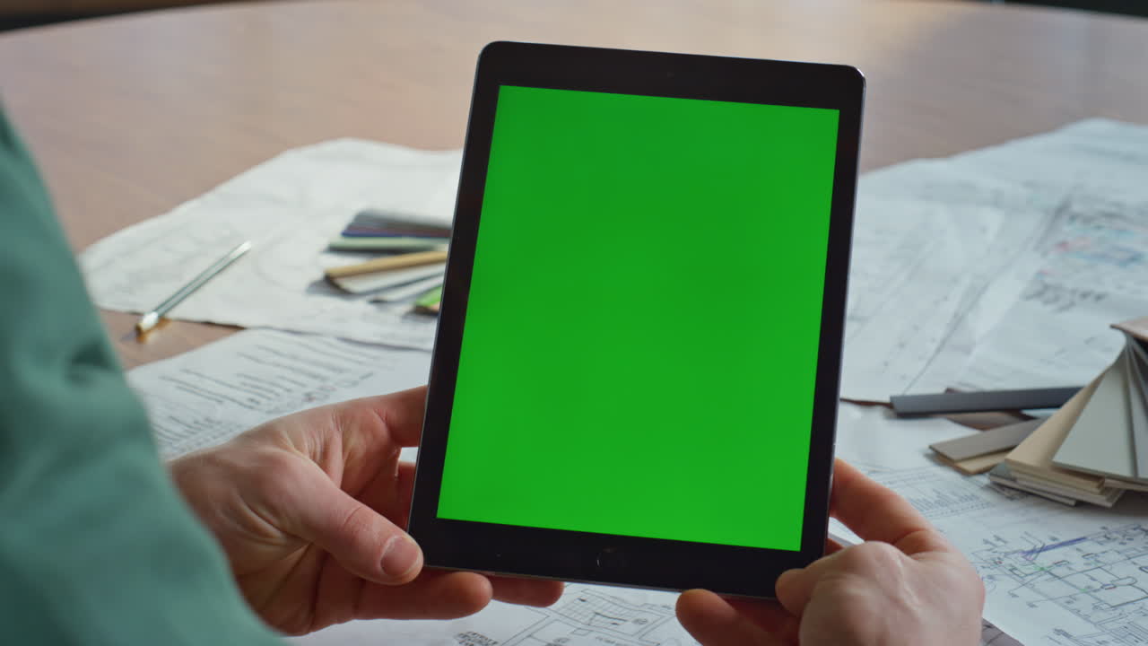 Creator watching mockup tablet at workplace architectural company closeup