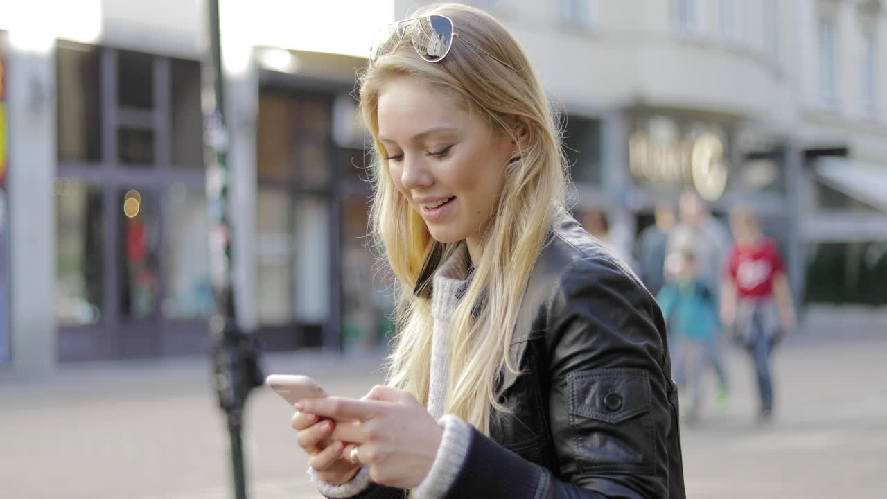 Happy woman using smartphone