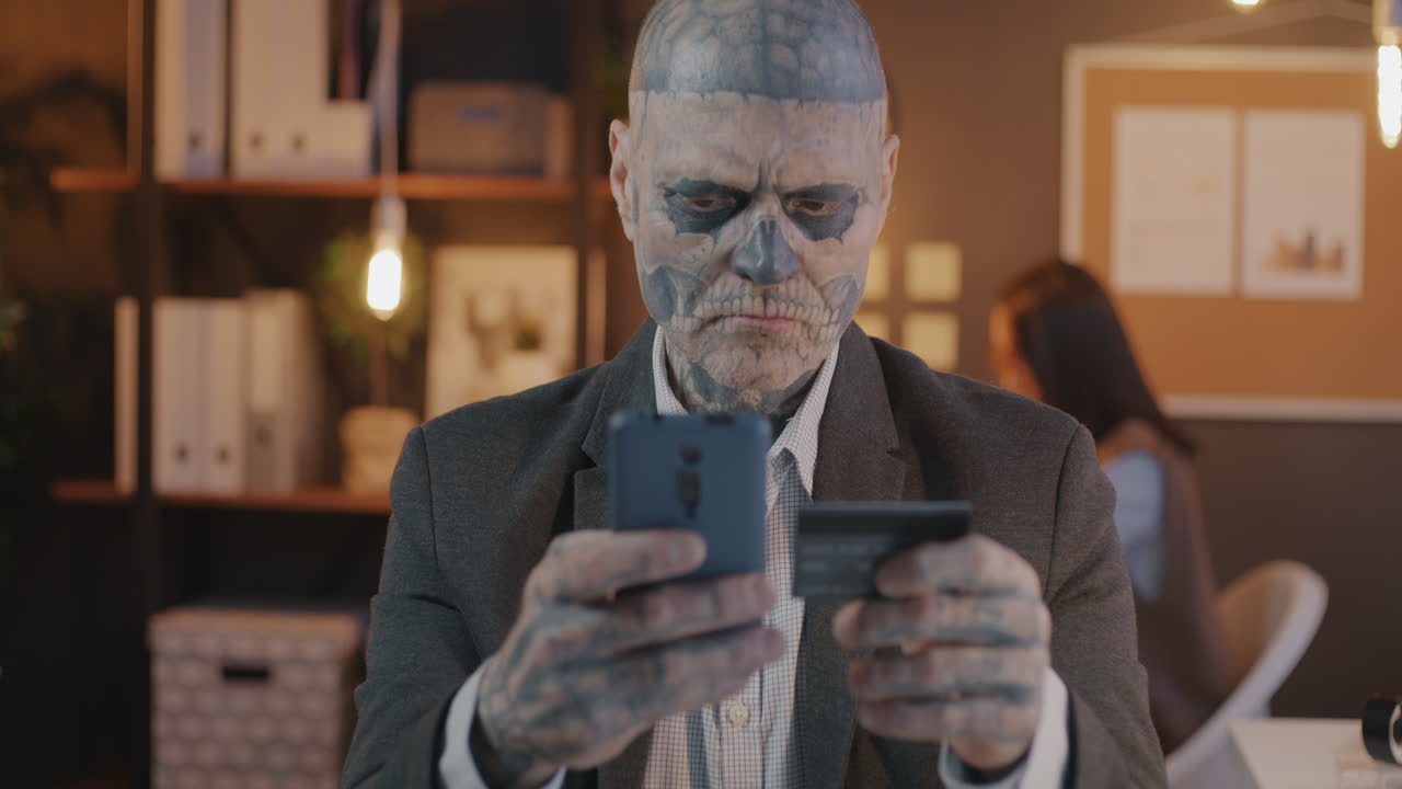 Businessman with Skull Makeup Makes a Payment