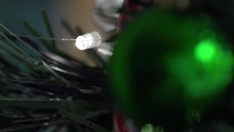 Pull-focus-to-Christmas-light-flashing-on-decorated-Christmas-tree