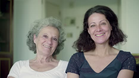 two smiling women looking at camera.