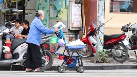 vendor selling goods on a busy street