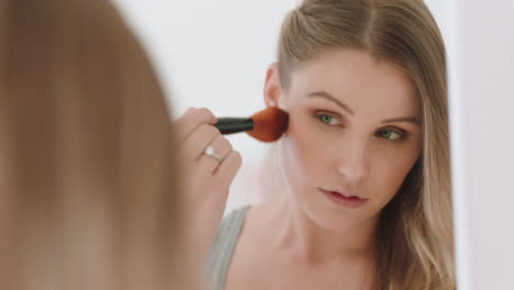 beautiful young woman applying makeup using brush looking in mirror at smooth complexion getting ready enjoying natural beauty in morning routine 4k footage