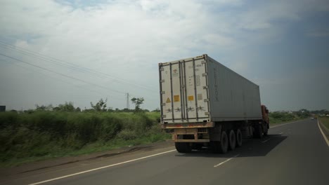 point of view shot of a container truck riding on indian highway