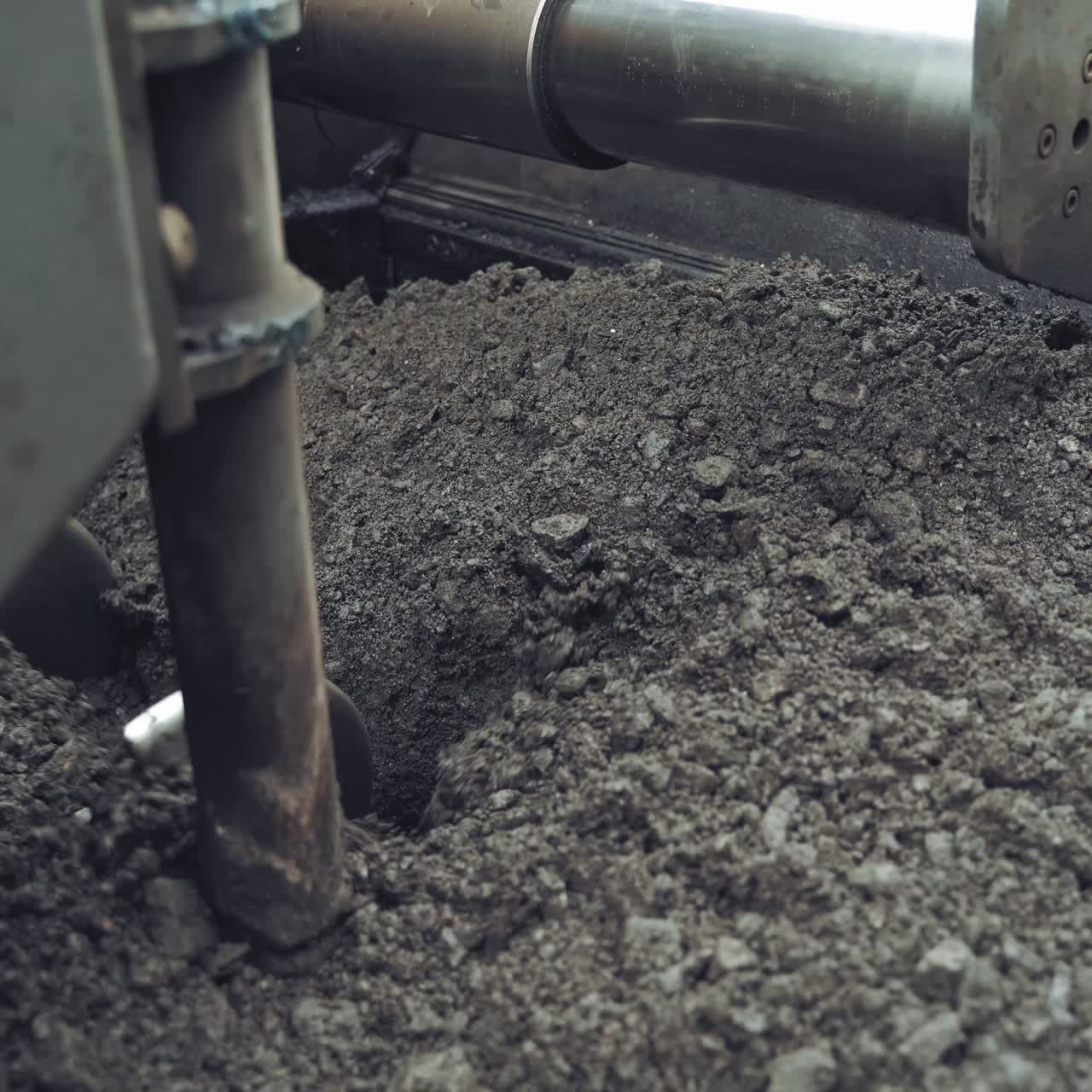 Asphalt unloaded from wheelbarrow