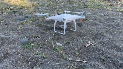 drone taking off on beach