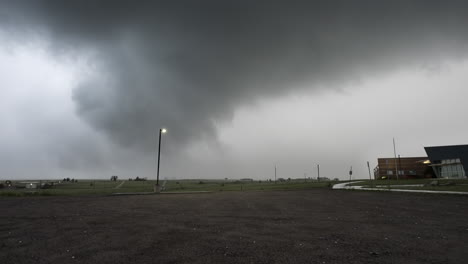 large hail falling from dark storm clouds steady moving shot