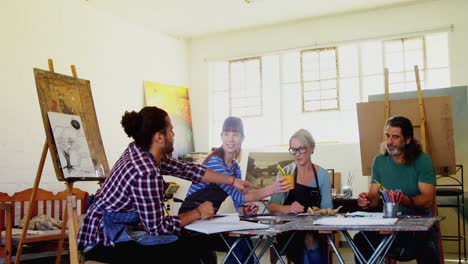 Group-of-artist-practicing-drawing-at-table-4k