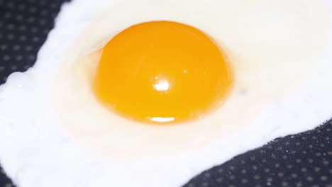 Pouring Egg on Frying Pan Cooking Fried Eggs Vertical Footage. Pouring egg on frying pan. Cooking fried eggs, closeup. Vertical footage