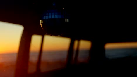 close-up of mirror ball hanging in van 4k