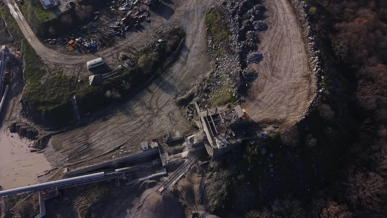Quarry site overview showing mining operations and equipment in action
