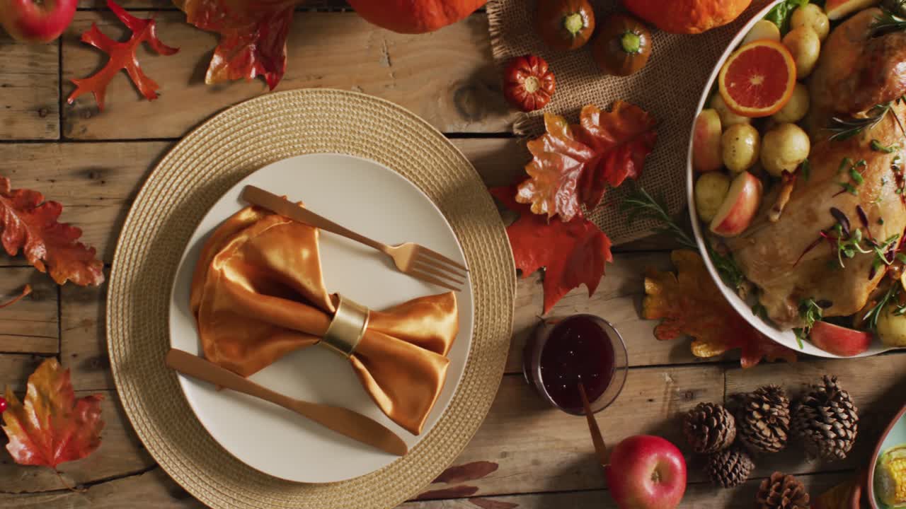 Video of tray with turkey, potatoes, pumpkins and decorated table prepared for thanksgiving