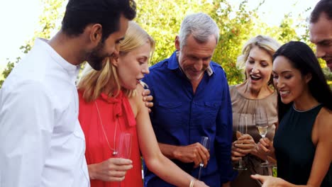 woman showing ring to her friends in balcony