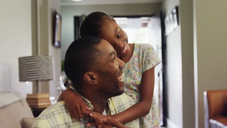 daughter embracing her father in living room 4k