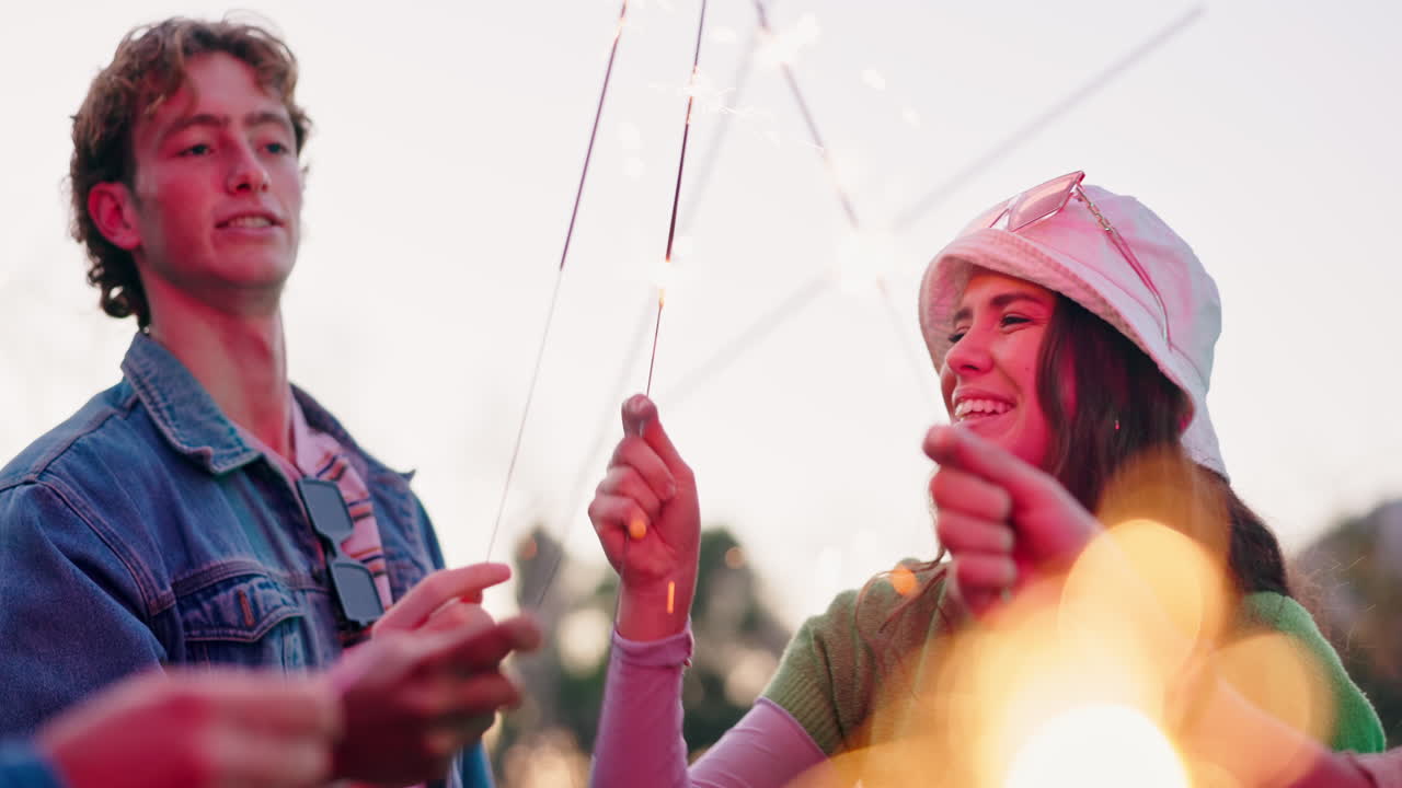 Group of friends celebrating with sparklers