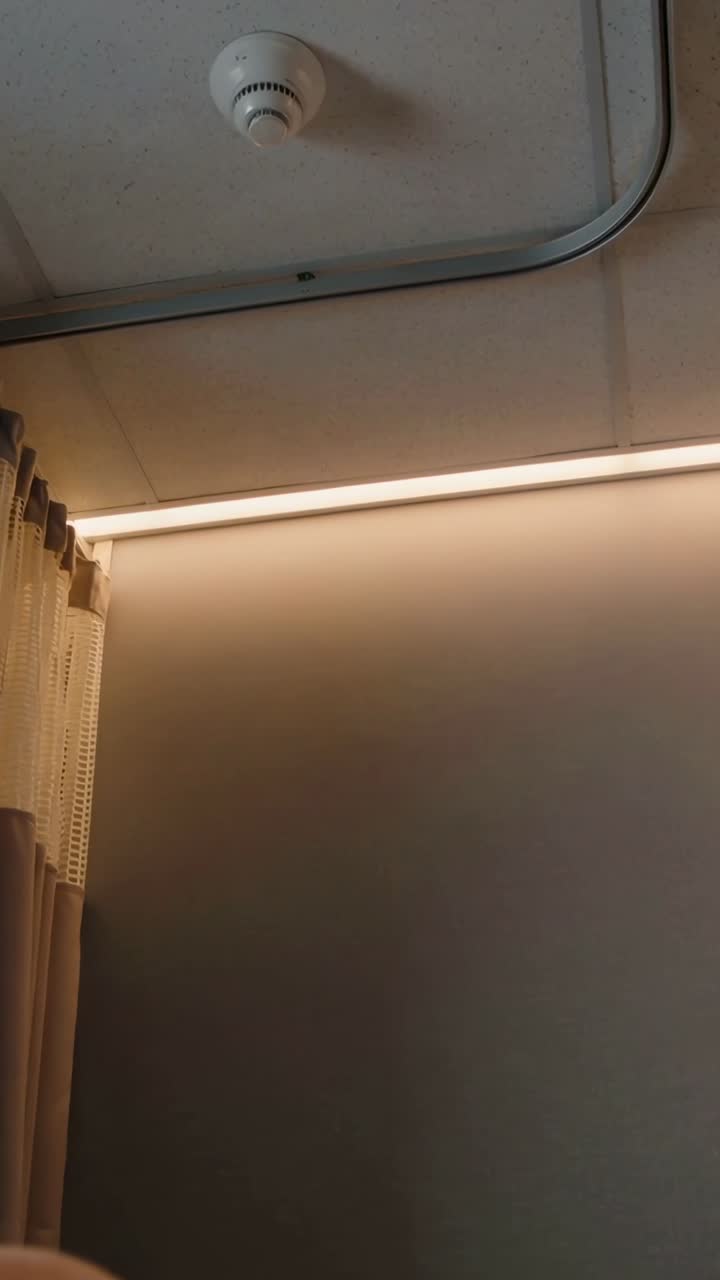 View of Ceiling with Smoke Detector, Light, and Privacy Curtain