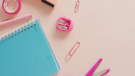 video of composition with school equipment on pink surface