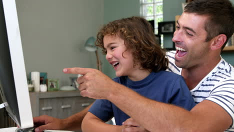 boy and dad laughing