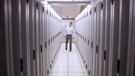 technician walking in server hallway