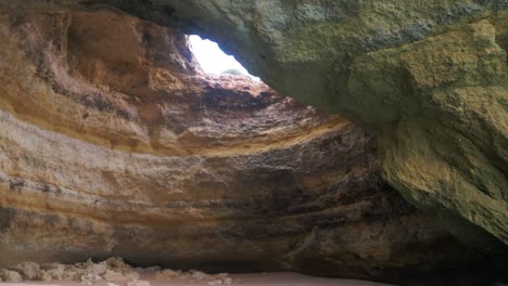 slowmotion inside the benigal cave in portugal tilting up to reveal this amazing cave