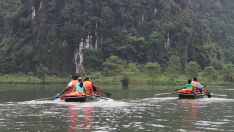 kayakers paddle gently across a calm lake