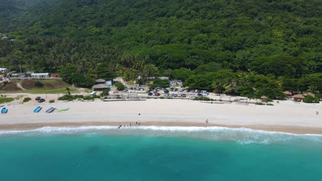 River-flowing-into-a-beach,-Los-Patos,-with-the-beach-and-the-river,-stunning-place-in-the-south-of-the-Dominican-Republic,-shortest-river-in-the-Caribbean