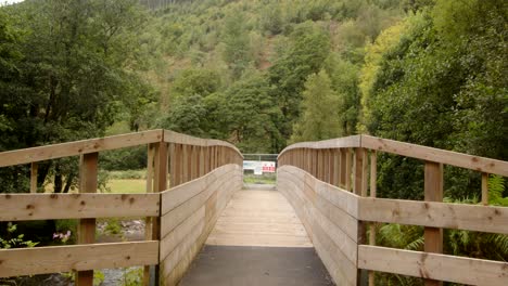 Mid-shot-of-the-Wooden-Bridge-over-the-Afan-river-in-the-AfanValley