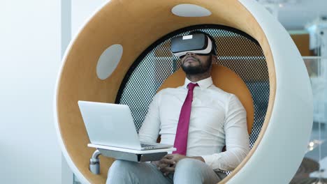 relaxed businessman in vr headset