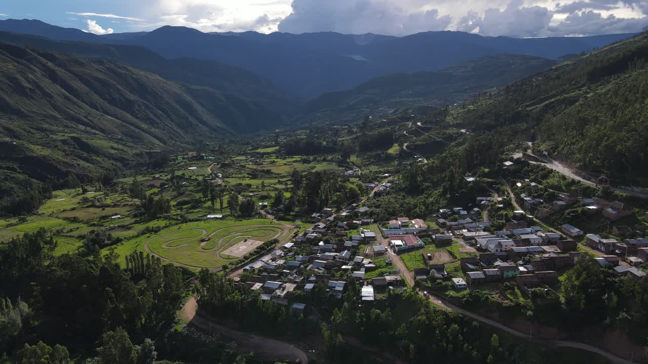 A scenic mountain village surrounded by lush nature, offering a serene view of traditional rural life