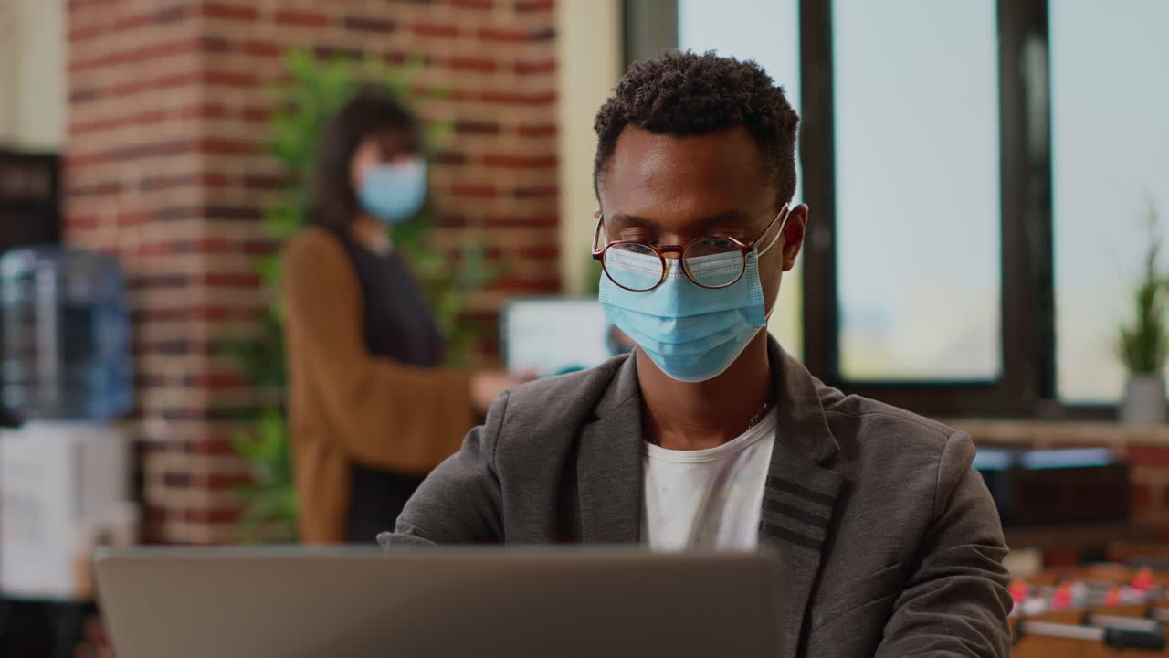 African american worker creating business report with research