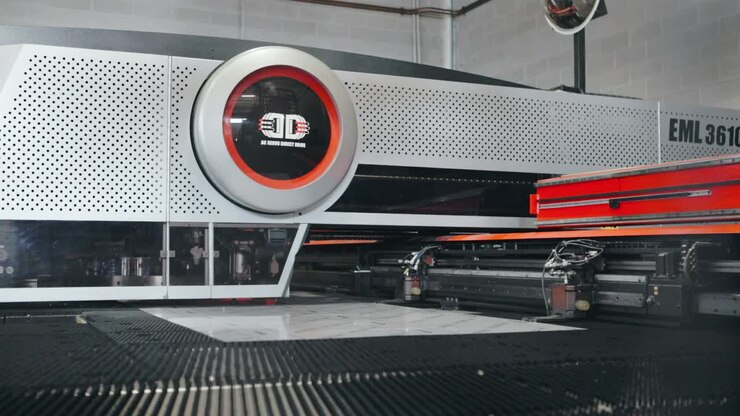 Computerized automatic cnc machine cutting sheet metal blanks in factory