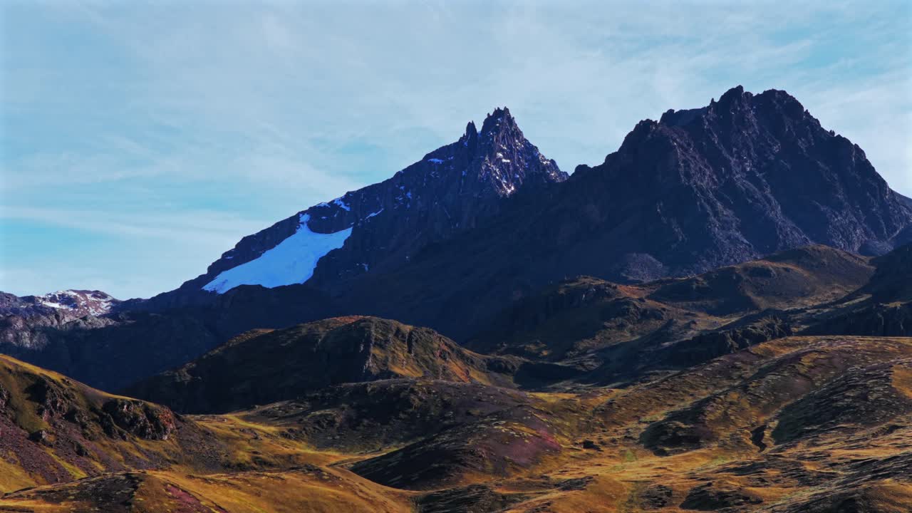 Peruvian Andes mountains Hatun Ritty Hatun Rit'i glacier aerial drone morning sunrise blue skies clouds Red Valley Rainbow Mountain Vinicunca Huancavelica Region Qoyllur Rit'i rainy season upwards