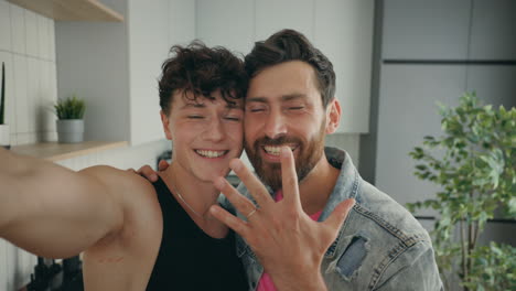 happy gay couple taking selfie, engagement celebration
