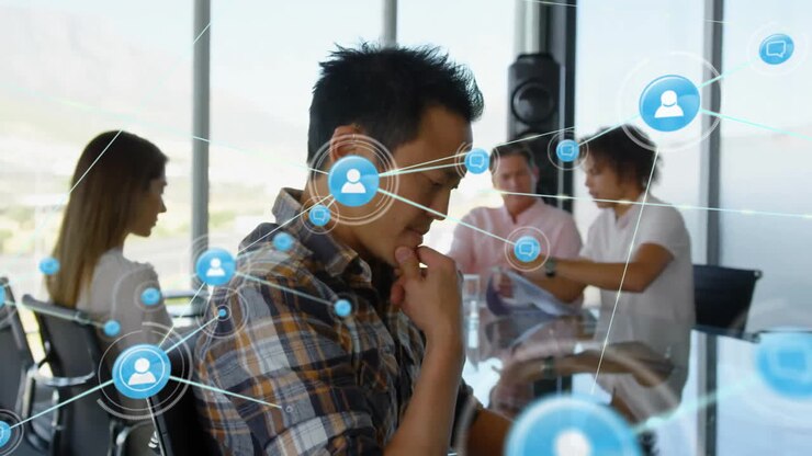 Animation of network of connections with icons over diverse business people in office