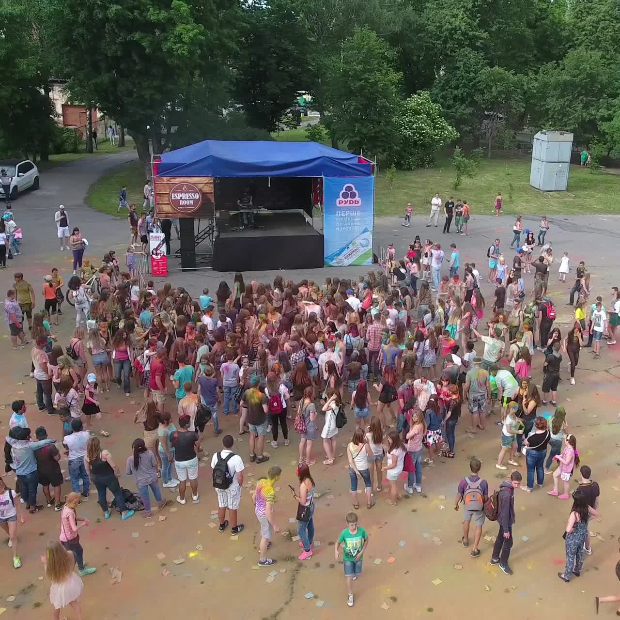 People Celebrating Festival Of Colors. VINNITSA, UKRAINE - JULY 2017: Young people at holi party covered with color powder