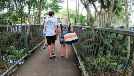 couple walking through lush zoo surroundings