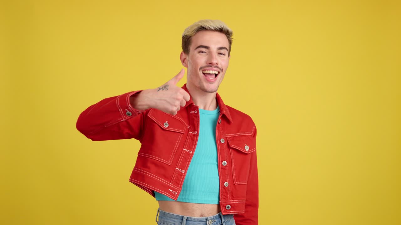 Man giving thumbs up in red jacket