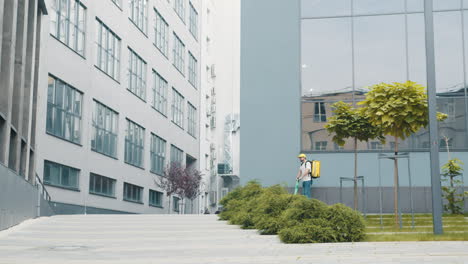 delivery person on scooter in urban cityscape