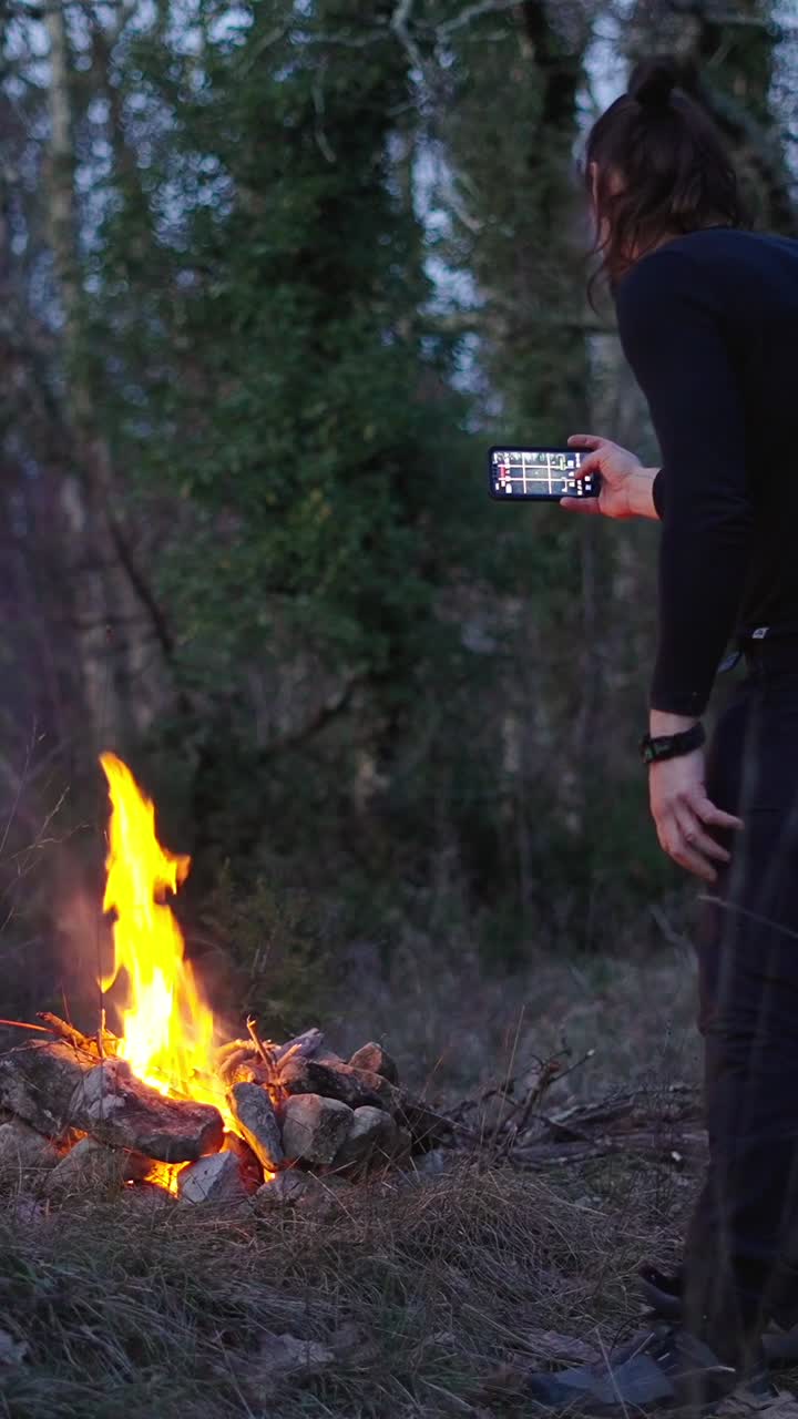 Man with campfire in forest