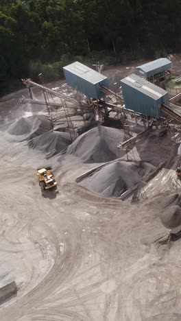 aerial view of a quarry or aggregate plant with heavy machinery