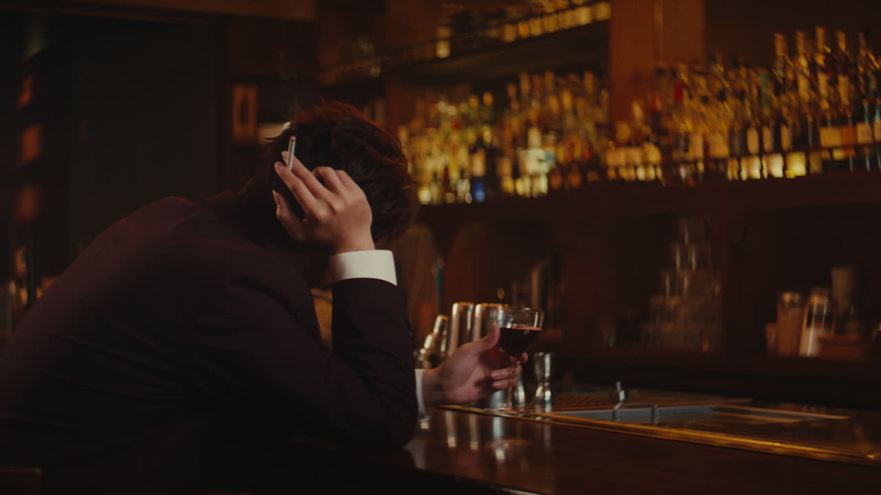 Man Sitting Alone at a Bar