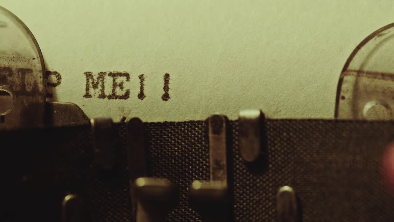 Typing Help Me Phrase on Paper with Analog Typewriter